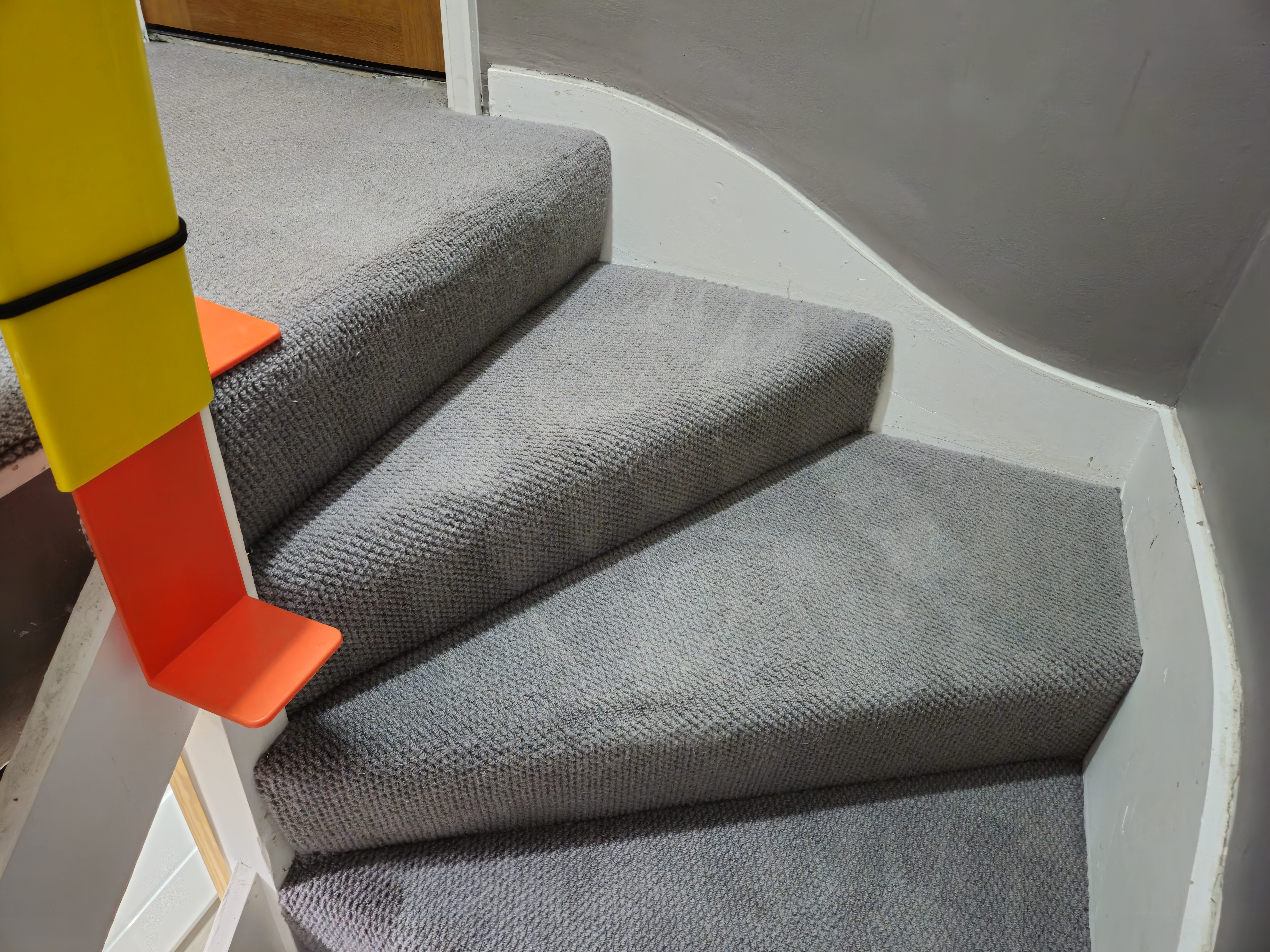 Professional stair carpet cleaning in progress